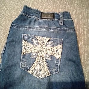 Silver jeans size 12 with studs on the back pockets.